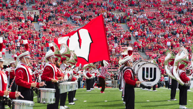 Bucky Badger running in (credit: Jeff Hanisch-USA TODAY Sports)